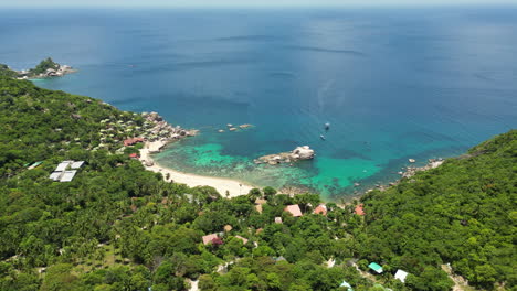 overview of tanote bay with coral reef under clear shallow sea on koh tao island in thailand