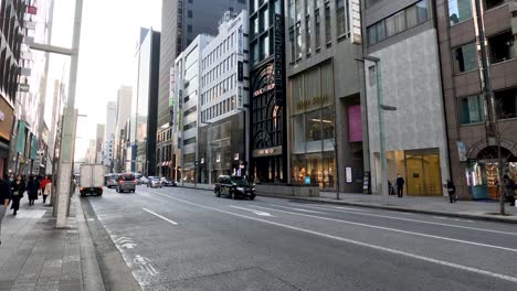 vehicles moving through a bustling city street