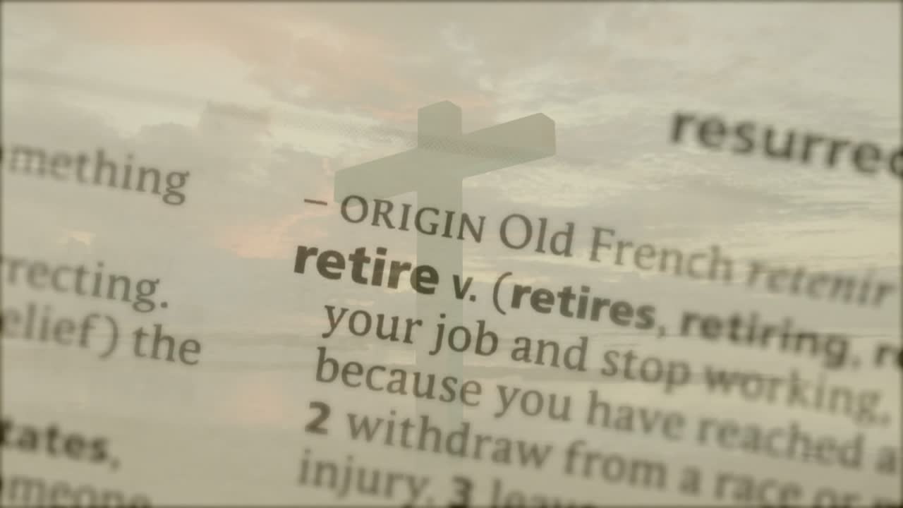 Focus shifting, dictionary page coming into clarity, translucent cross revealing retire definition