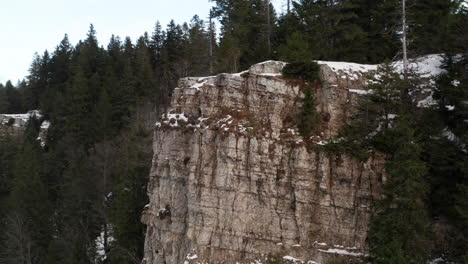 aerial of mountain ridge in creux du van, switzerland