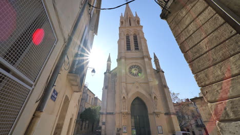 church in montpellier with beige limestone walls france sunny day lockdown perio