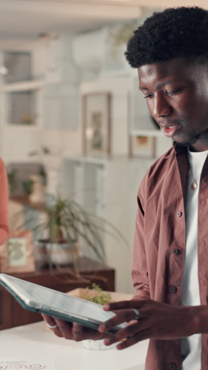 Young Black Man Using Digital Tablet and Smiling