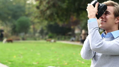 happy photographer taking photographs outdoors