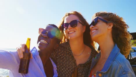 Group-of-female-friends-having-fun-in-the-beach-4k