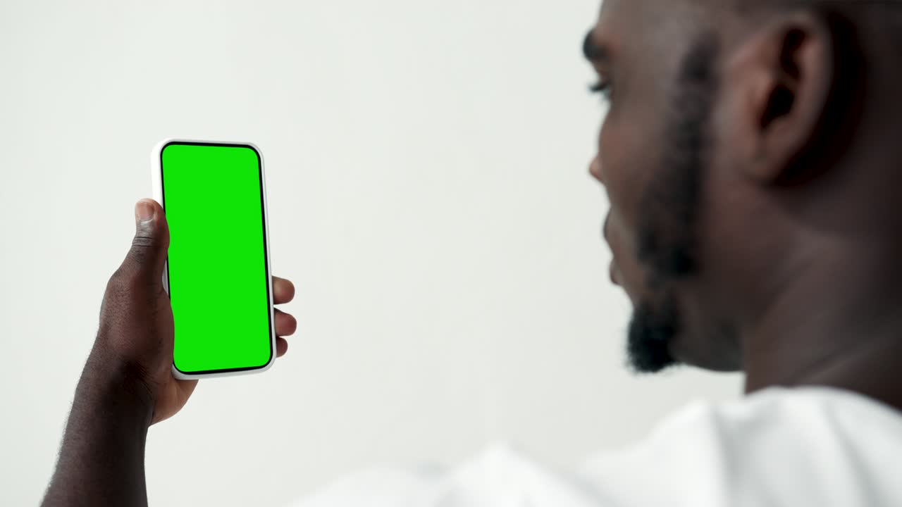 Young Person Touch Screen Smartphone with Green Chroma Key Close-up. Guy Tapping Gesture on Cell Phone Mock-up. Concept Watch and Show Internet Social Media, Calls, Read News, App, iot, e-Shopping 4k