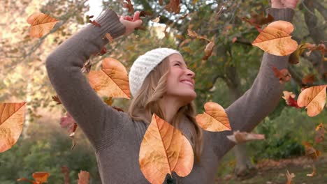 animation of autumn leaves falling over happy caucasian woman in park