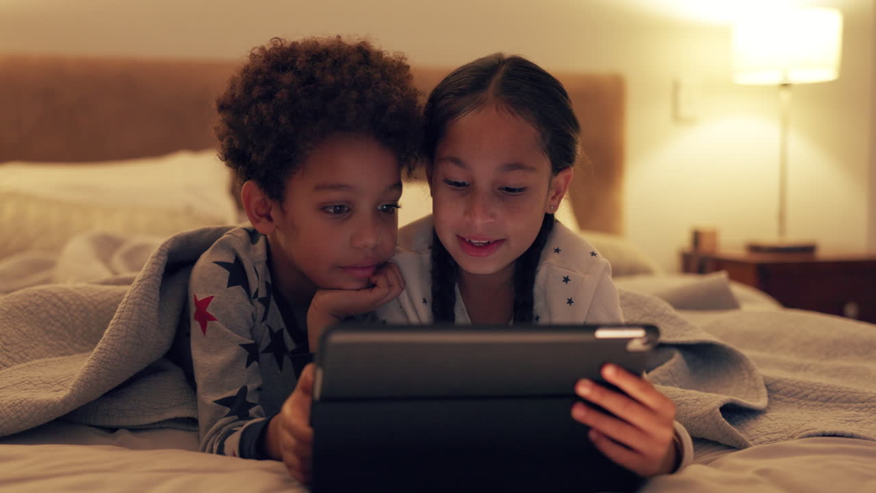 Kid, together and watching a video on tablet