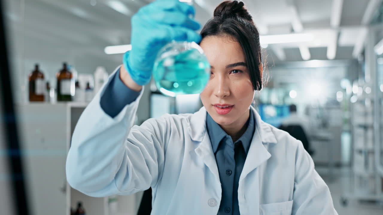 Female Scientist in a Lab Conducting a Chemistry Experiment