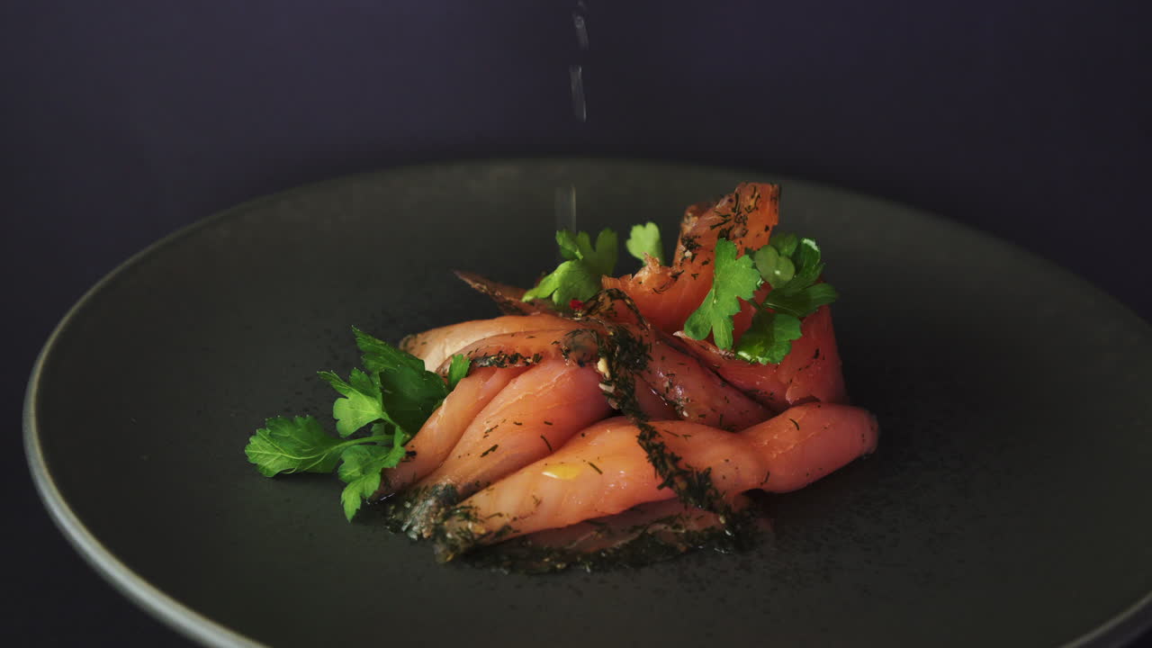 Squeezing lemon on Smoked Salmon