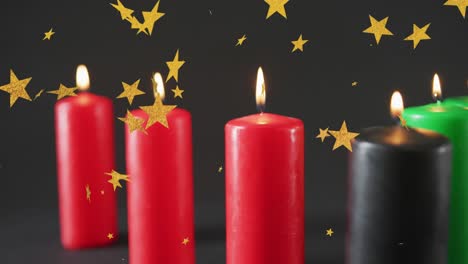 Animation-of-golden-stars-over-kwanzaa-candles-on-black-background