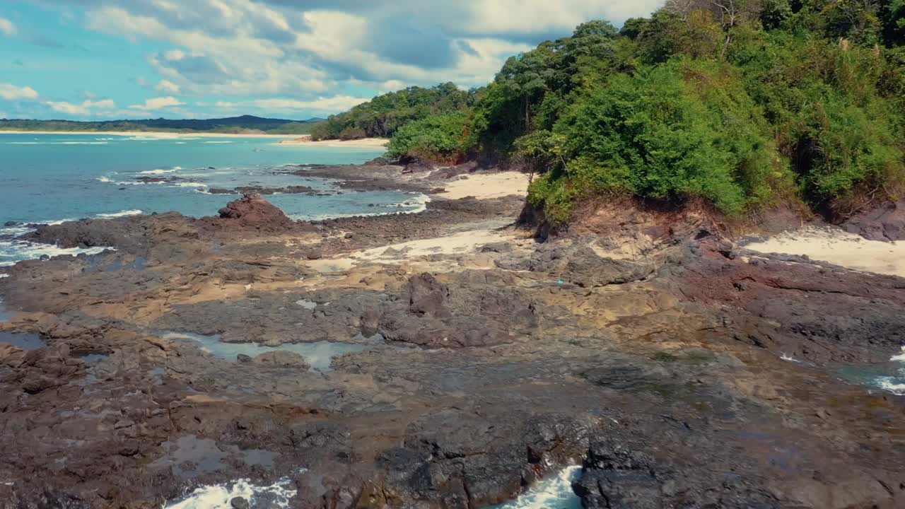Drone footage of a wonderful island with a beautiful beach, low altitude forward movement