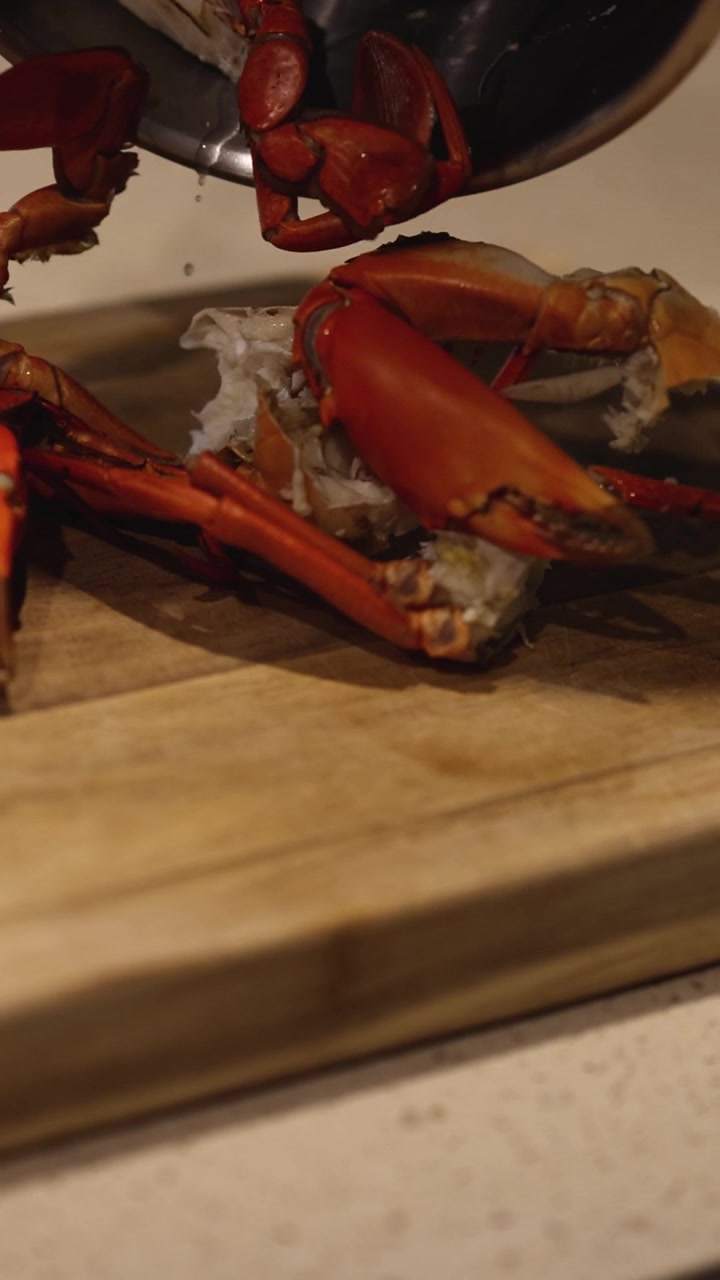 Cooking crab, transferring from pot to cutting board
