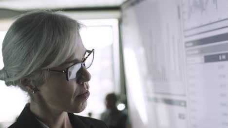 closeup portrait of focused businesswoman reading data