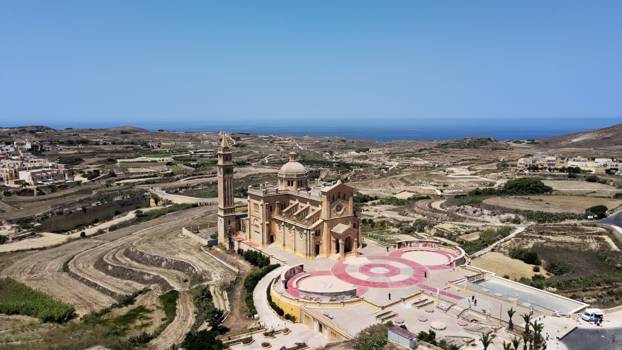 Wide aerial drone view of Ta Pinu Basilica and countryside in Gharb, Gozo Malta