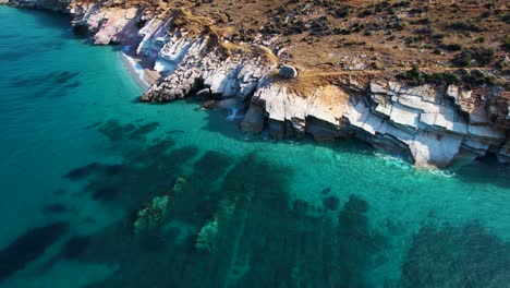 idyllic beach vacation: clean emerald sea water, rocky seashore, and panoramic views in lukova, albania - a coastal paradise