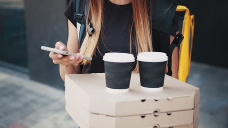 woman delivering pizza and coffee orders