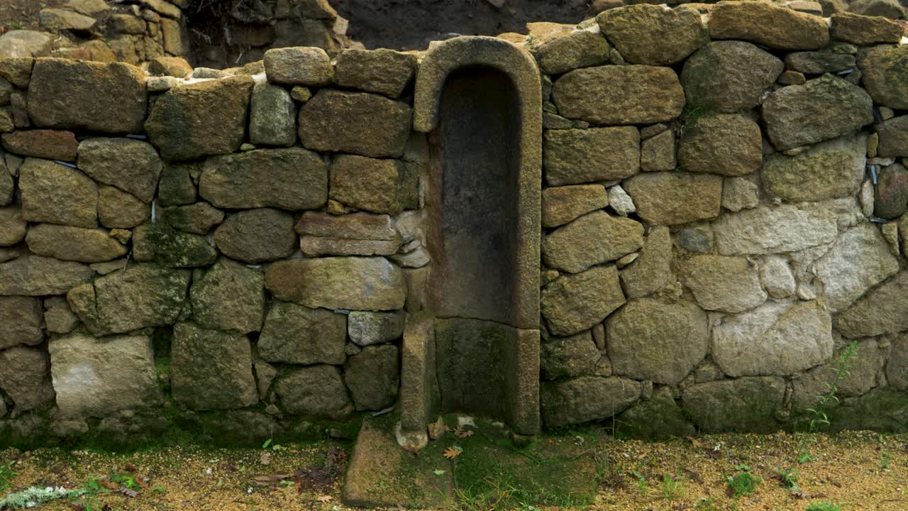 Stone wall ruins of Castro Cibdá de Armeá, an archaeological site in Santa Mariña de Augas Santas, Galicia