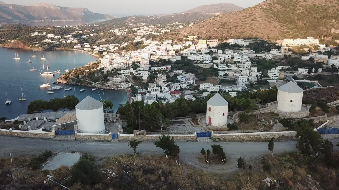 Aerial View of a Greek Island Village with Windmills
