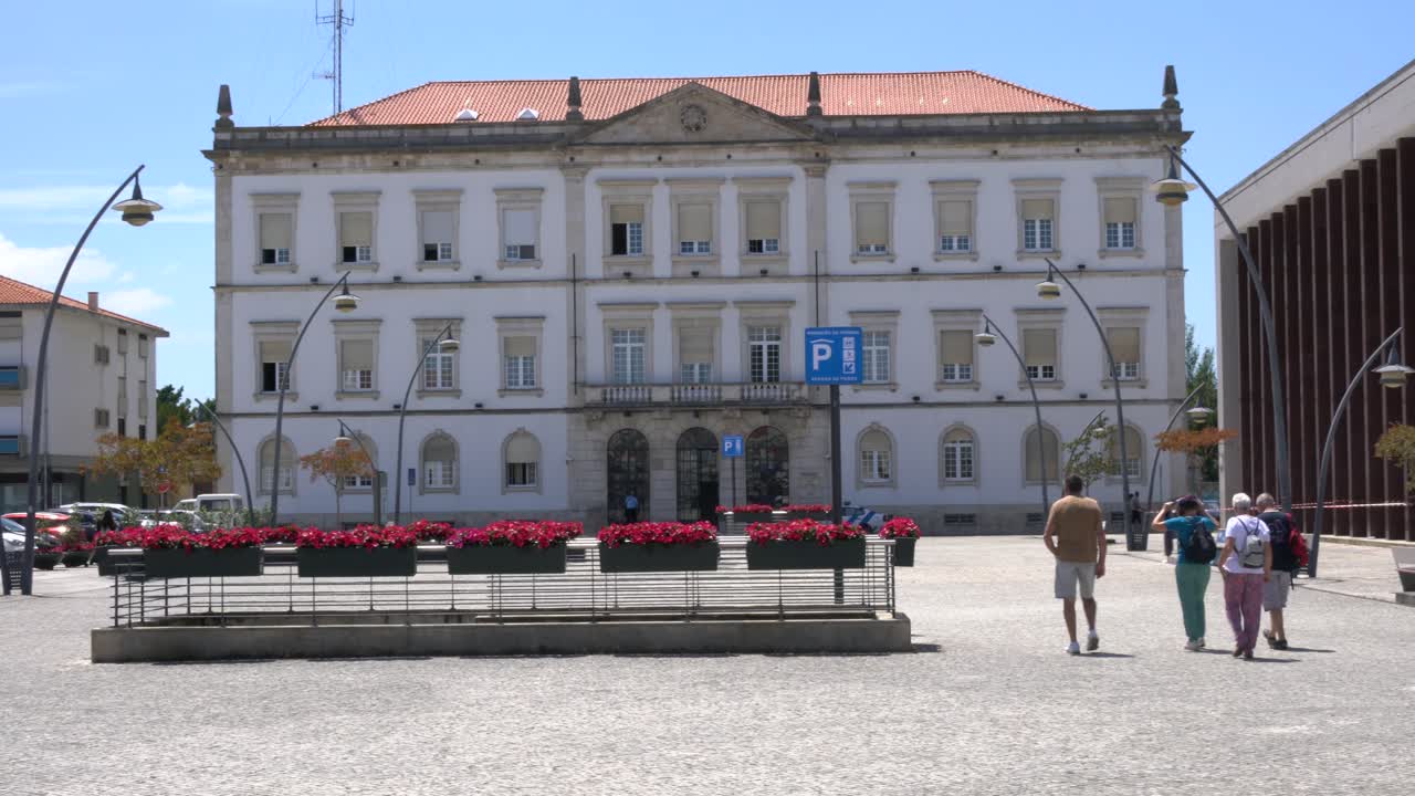 People explore outside the Marques do Pombal Square (Praça do Marquês de Pombal) in Aveiro, Portugal.