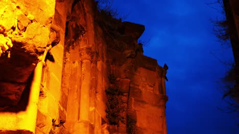 creepy view of the ruins of an old gothic church with dark birds