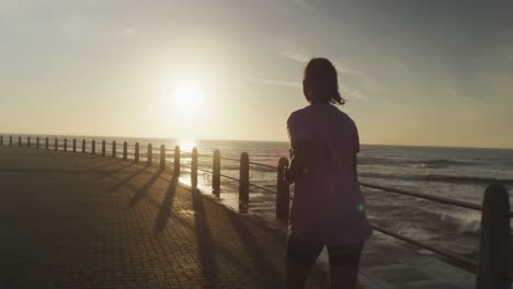 Senior-woman-running-on-a-promenade