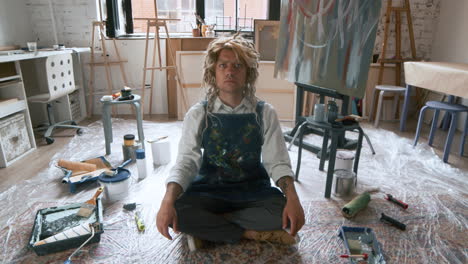 Artist sitting in an art studio