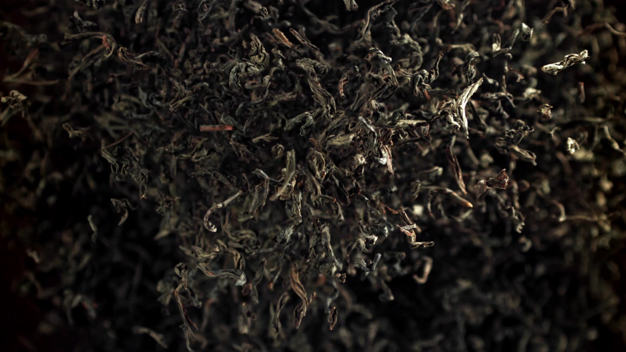 Super Slow Motion of Dry Black Tea Leaves Falling