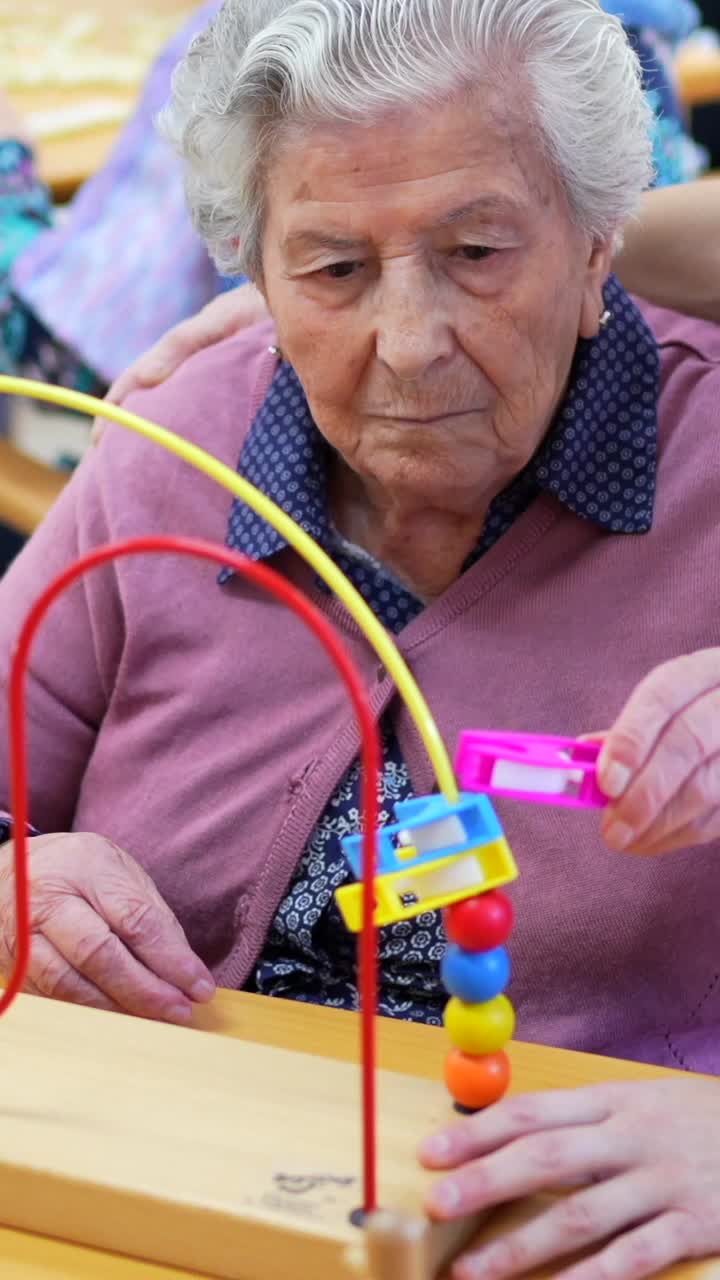 Elderly woman playing a cognitive game