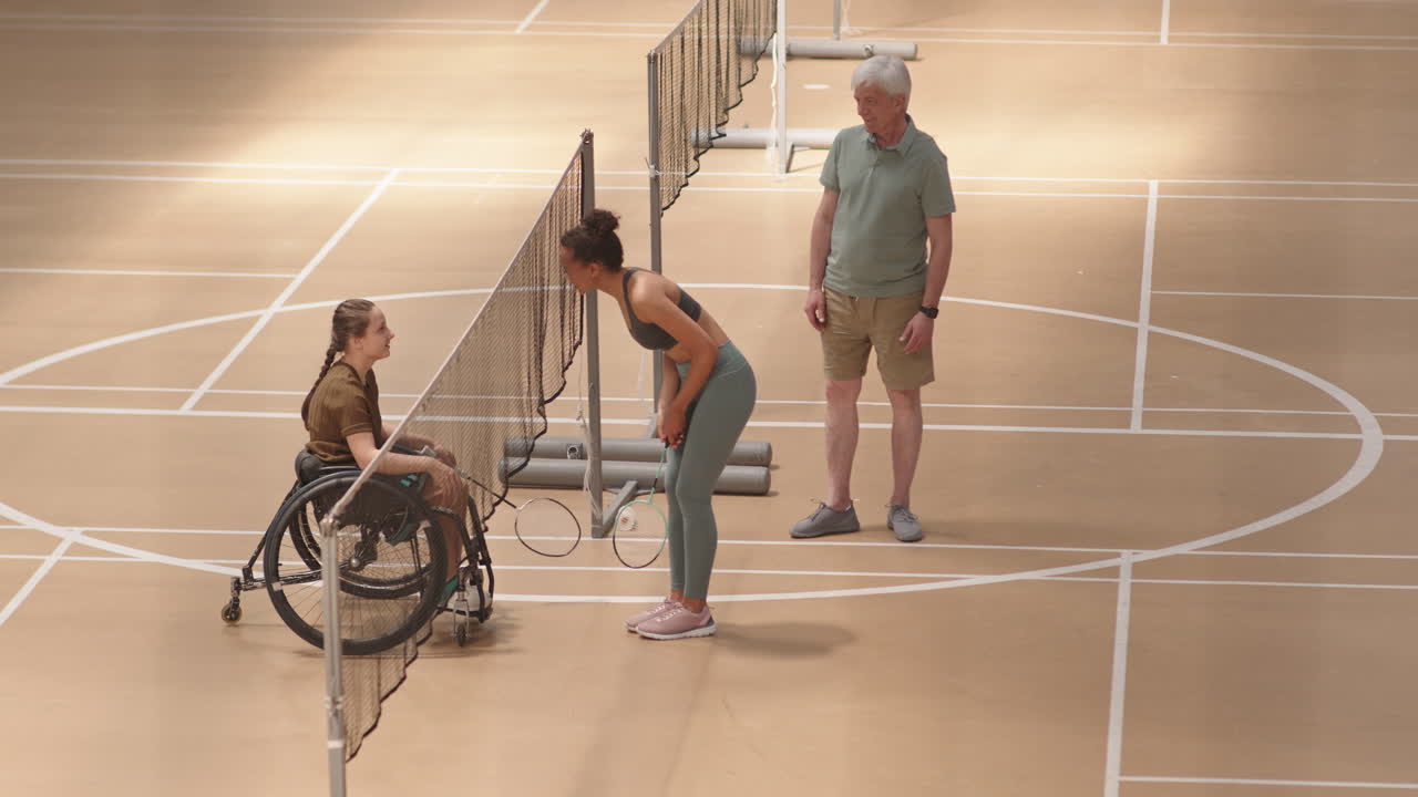 Opponents Shaking Hands After Badminton Match