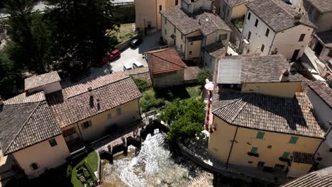 aerial flying overhead rasiglia, a small village located in the province of perugia