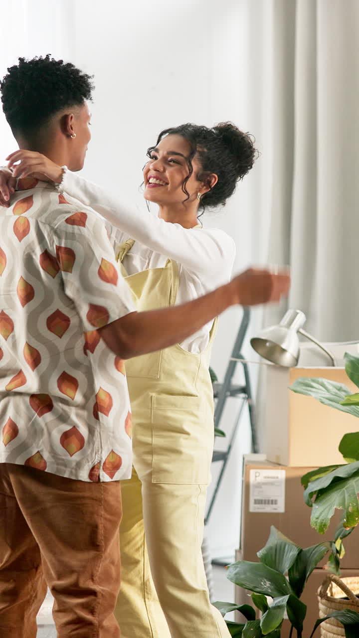 Couple embracing in their new home