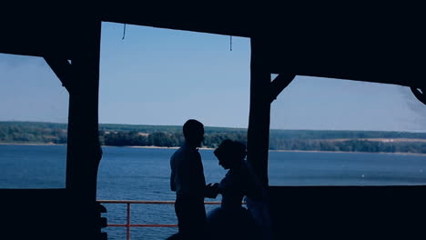 silhouette of couple in love. silhouette of bride and groom posing during sunset