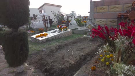 tombs adorned with cempasuchil marigold flowers for the celebration of the day of the dead in mexico puebla cholula. travel shot