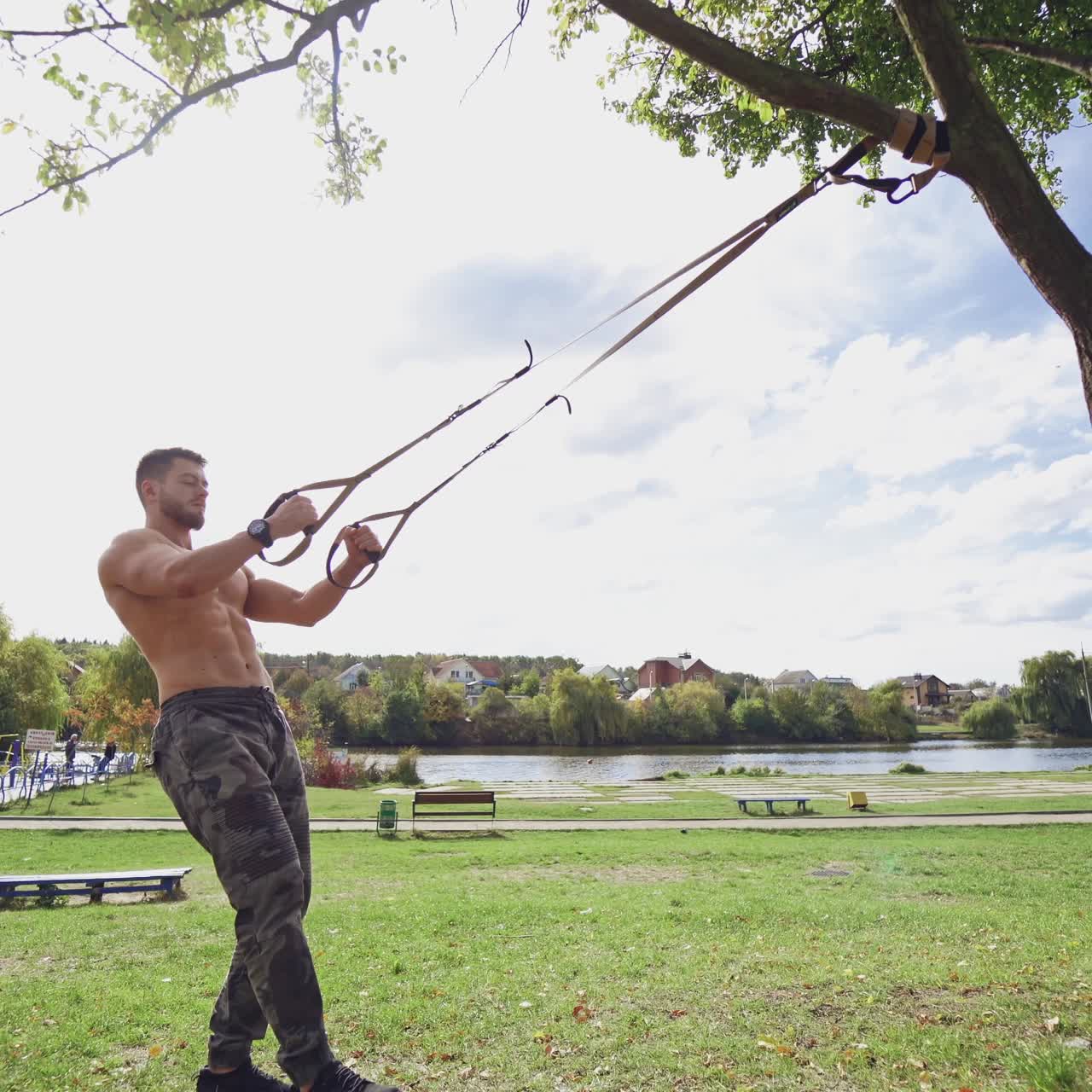 . Shirtless male exercise outdoors. Muscular athlete exercising push up outside