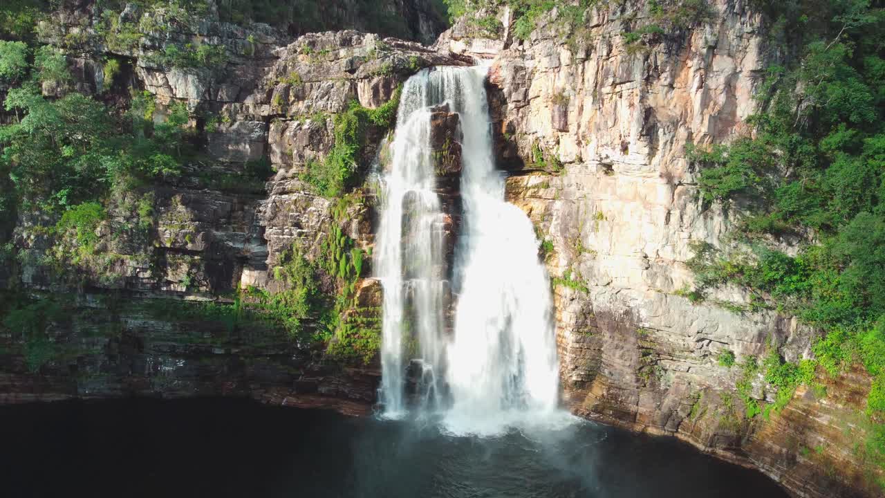 Stunning Aerial View of a Majestic Waterfall Cascading Down a Cliffside