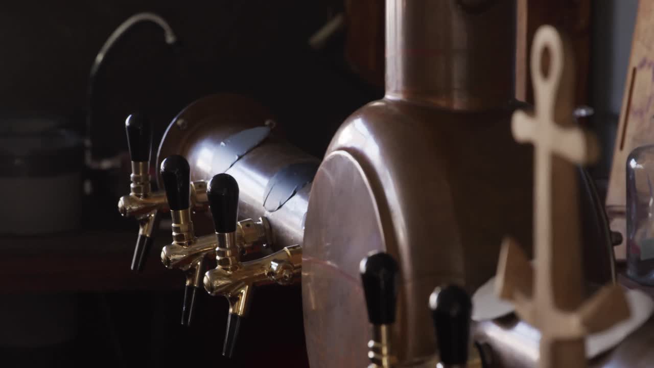 Brewery equipment and beer taps behind the counter at a microbrewery