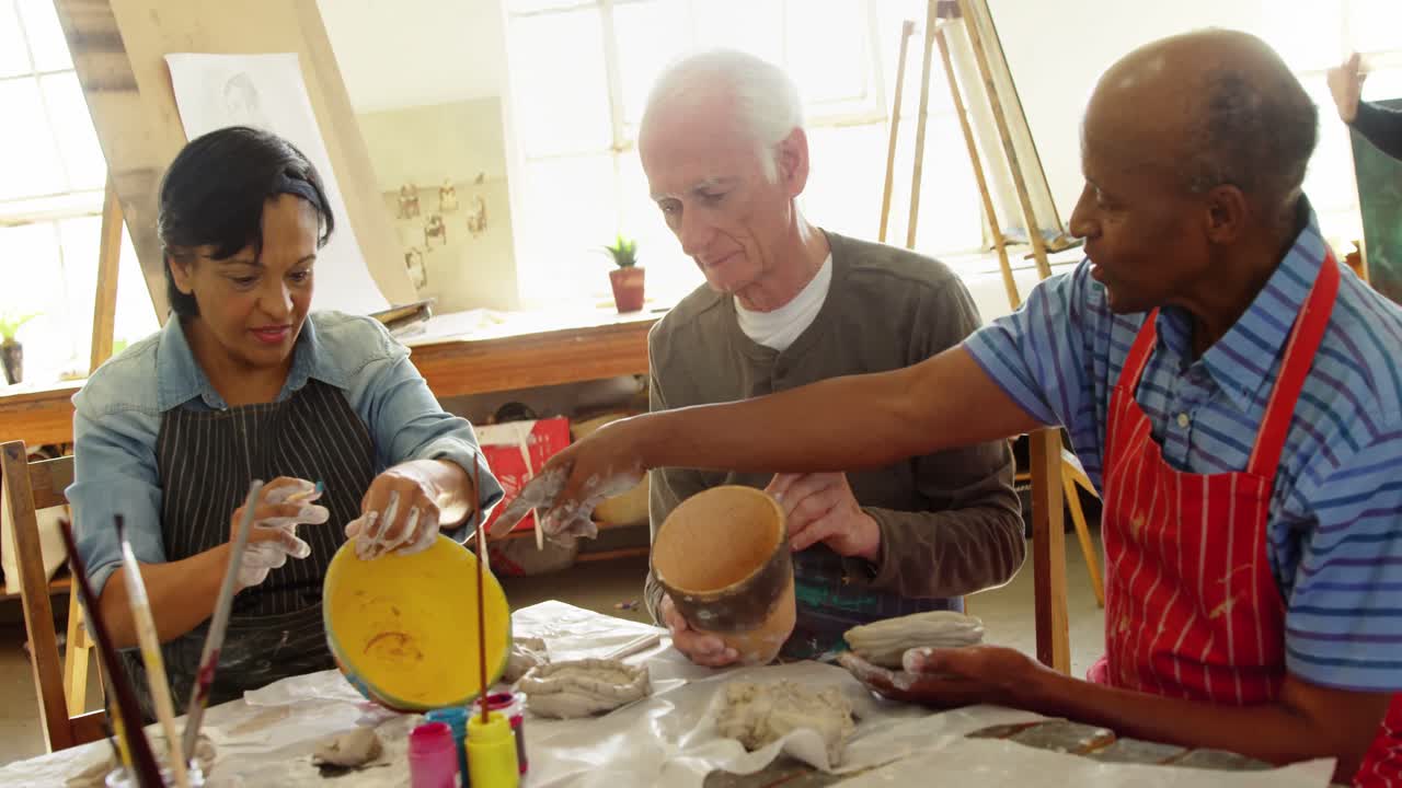 Artist painting bowl at table 4k