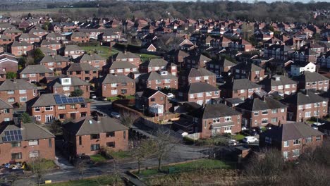 Suburban-Neighbourhood-residential-Cornwall-homes-rooftops-real-estate-property-aerial-dolly-left-view