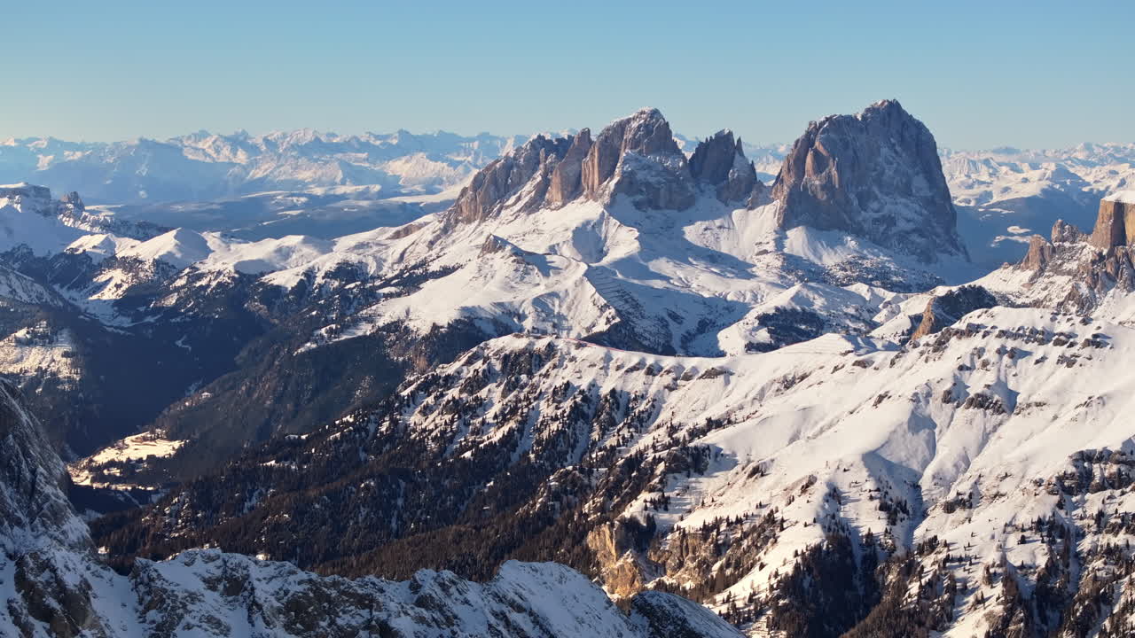 Aerial drone view of the Marmolada mountain in the Dolomites, northeastern Italy with the blue sky on the background