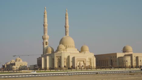 the al qasimia university mosque with architectural structures nearby in sharjah, uae - wide shot