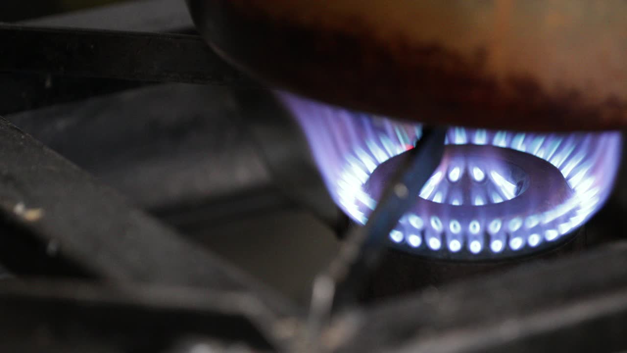 High Flamed Stove On A Copper Cookware At The Kitchen