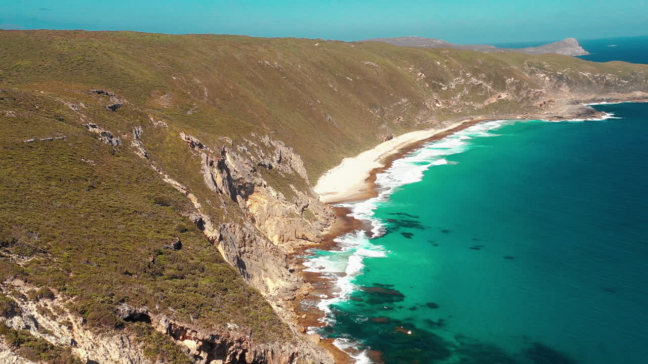 Aerial, drone shot overlooking cliffs at the the sharp point lookout, a beach and the Coast of Albany, western Australia