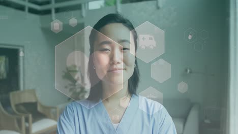 병원에서 미소 짓는 아시아 여성 의사 위에 의학 아이콘의 애니메이션