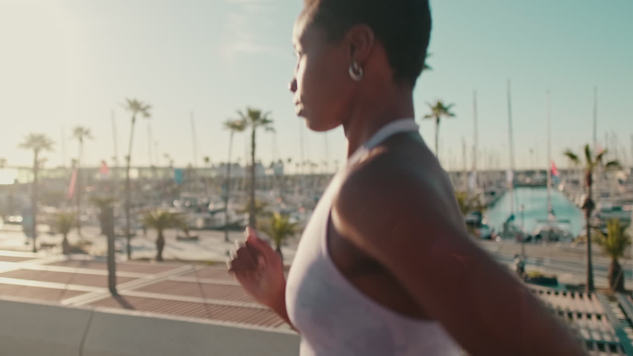 Young African American Woman Running by Marina on Sunny Morning
