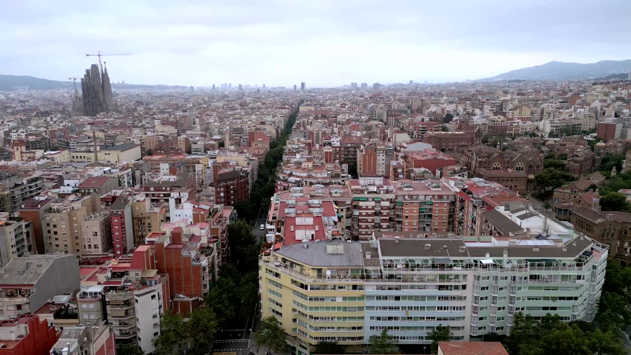 Aerial drone shots of Barcelona's cityscape and the unfinished Antoni Gaudi architecture La Sagrada Familia