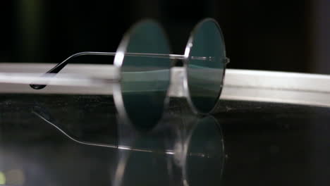 throwing glasses on a table