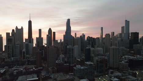 near north side skyline, dawn in chicago, united states - pull back, aerial view