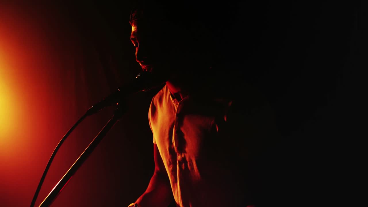 Man singing song while playing electronic keyboard 4k