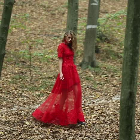 young woman walks in forest