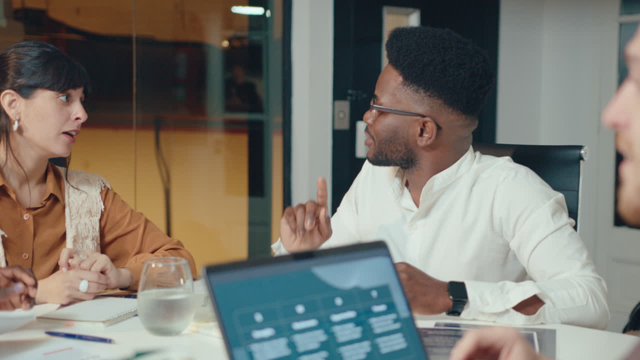 African American Boss Leading Business Meeting with Team in the Office